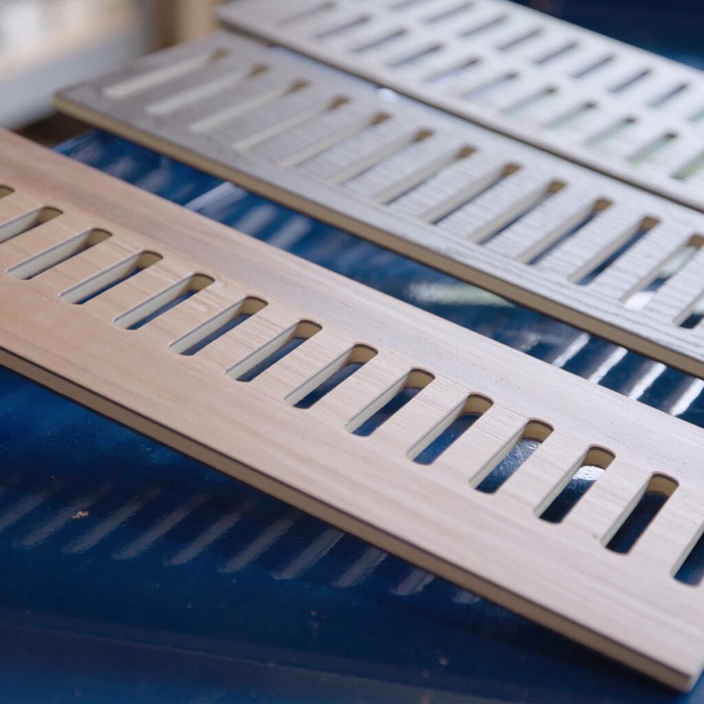 Close-up view of custom floor vent covers Aurora IL crafted from matching wood laminate material.